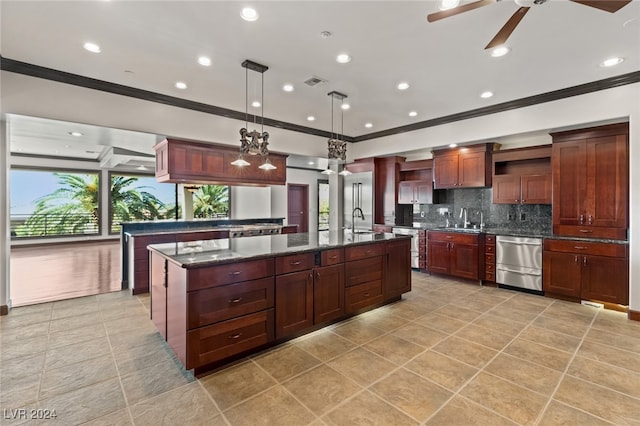 kitchen with tasteful backsplash, dishwasher, ceiling fan, decorative light fixtures, and sink