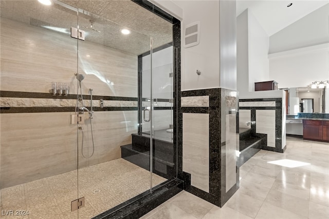 bathroom with vanity and a shower with shower door