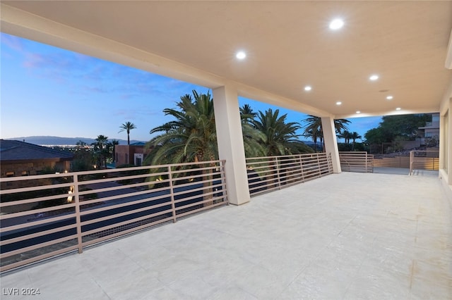 patio terrace at dusk with a balcony