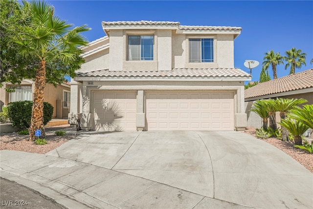 mediterranean / spanish-style house featuring a garage