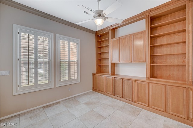 unfurnished room with ornamental molding, ceiling fan, and light tile patterned floors