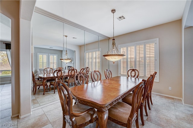 dining area featuring light tile patterned floors