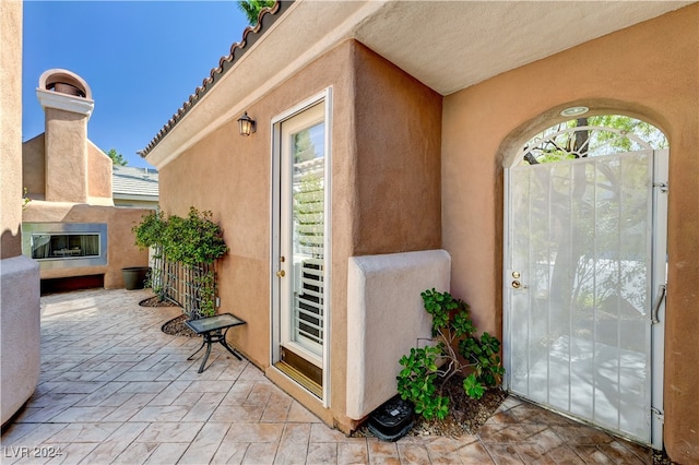 property entrance with a patio area