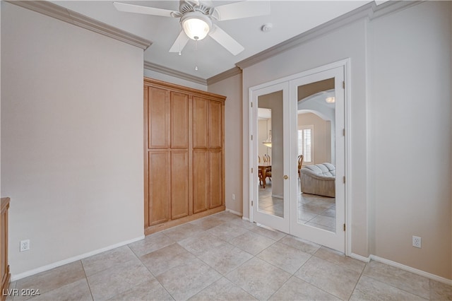 unfurnished bedroom with light tile patterned floors, ornamental molding, ceiling fan, and french doors