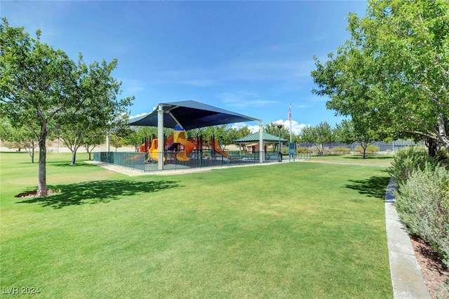 view of community featuring a playground, a gazebo, and a yard