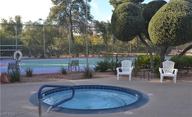 view of pool featuring a community hot tub and tennis court