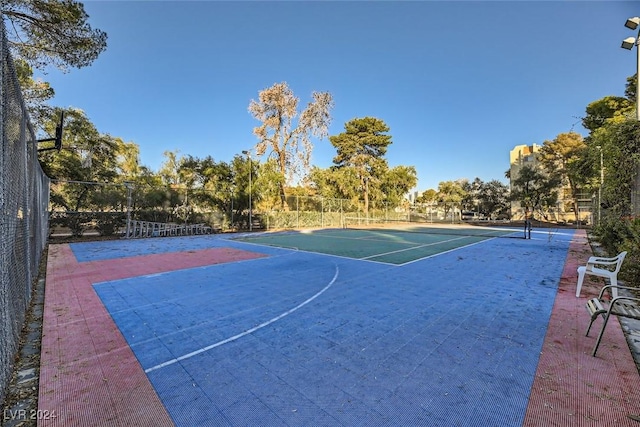 view of sport court featuring tennis court