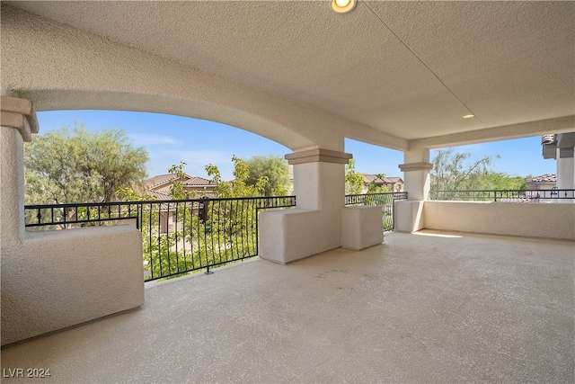 view of patio featuring a balcony