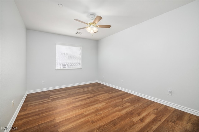 empty room featuring wood-type flooring and ceiling fan