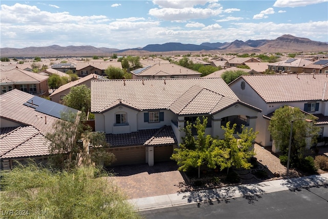 birds eye view of property featuring a mountain view