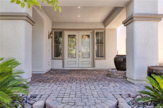 entrance to property with a patio and french doors