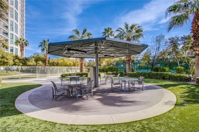 view of home's community with a patio and a yard