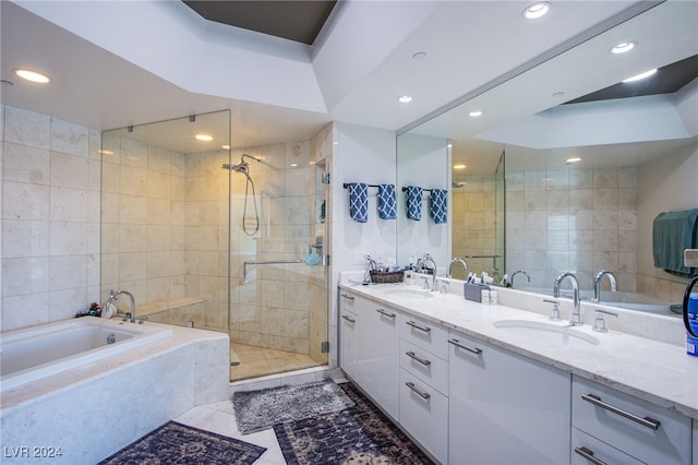 bathroom featuring vanity, tile walls, separate shower and tub, and tile patterned floors