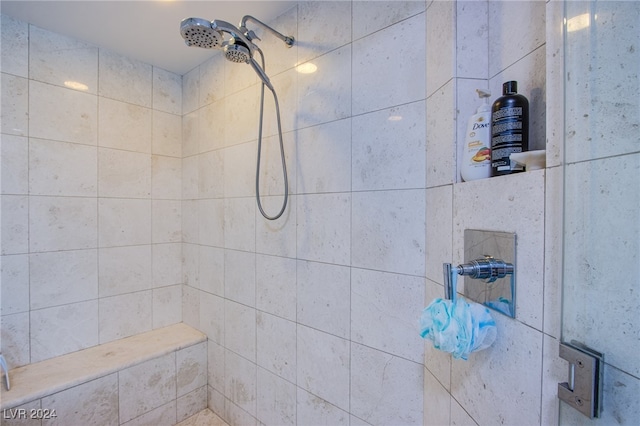 bathroom with a tile shower