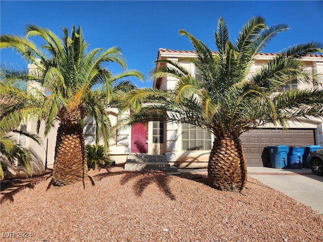 view of front of property with a garage