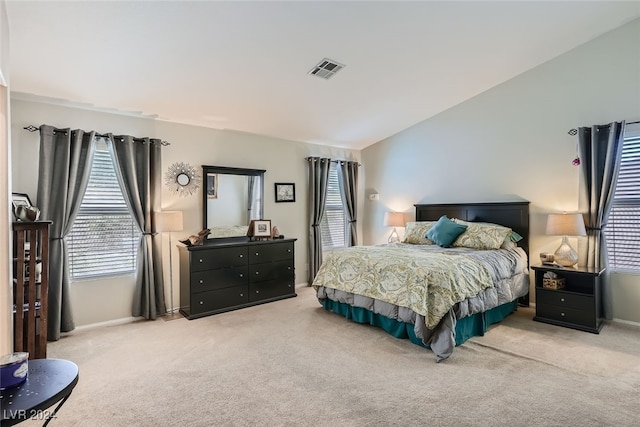 bedroom with light colored carpet