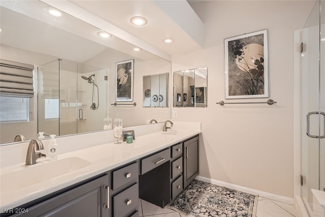 bathroom with vanity, a shower with shower door, and tile patterned flooring