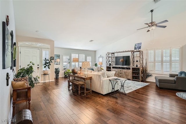 living room with vaulted ceiling, dark hardwood / wood-style flooring, and ceiling fan