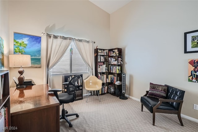 carpeted office featuring vaulted ceiling