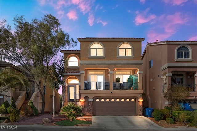 mediterranean / spanish house with a garage