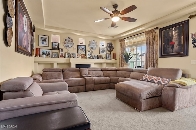 living room with carpet flooring and ceiling fan