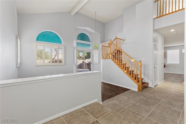 foyer entrance featuring high vaulted ceiling, beamed ceiling, and hardwood / wood-style floors