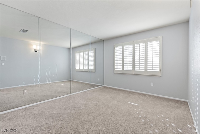 unfurnished bedroom with carpet flooring