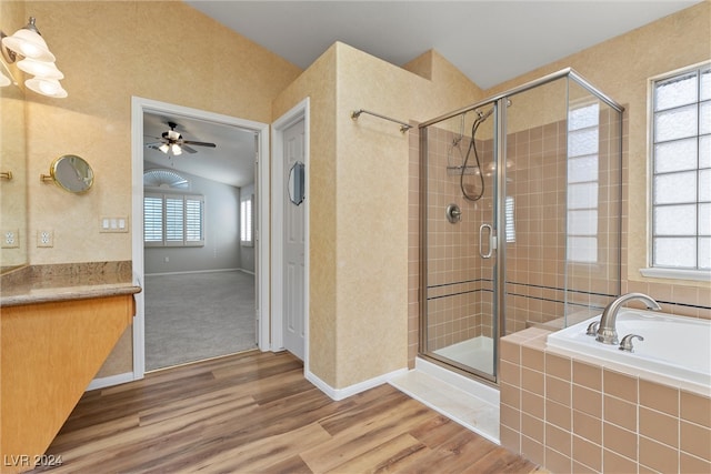 bathroom featuring independent shower and bath, vanity, ceiling fan, and hardwood / wood-style flooring