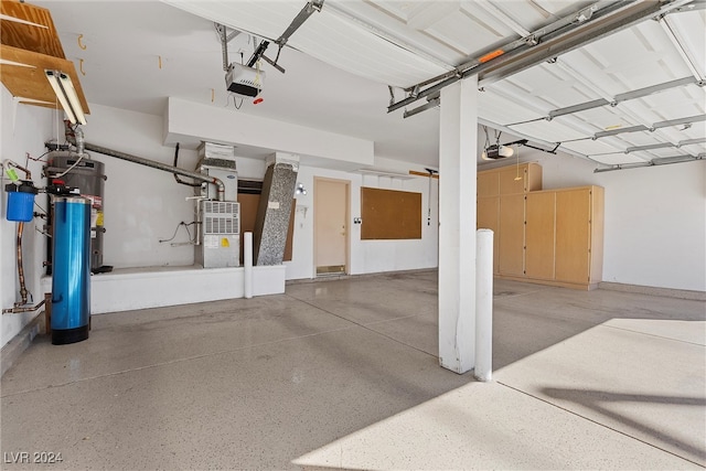 garage with a garage door opener and heating unit