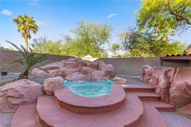 view of swimming pool featuring pool water feature