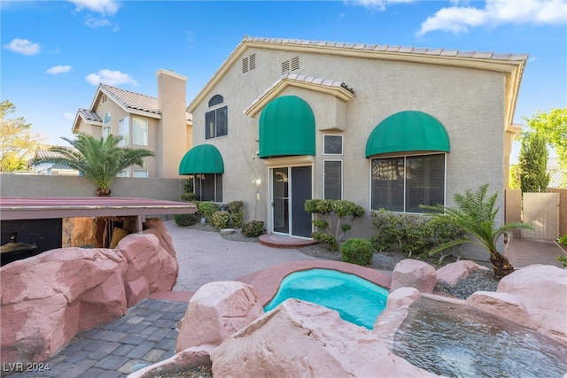 view of pool featuring a patio