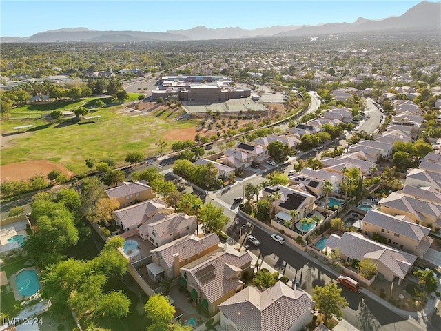 birds eye view of property with a mountain view