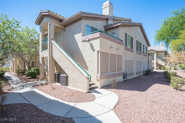 view of side of property featuring cooling unit