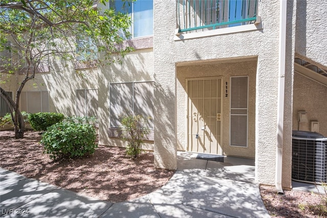 doorway to property with cooling unit