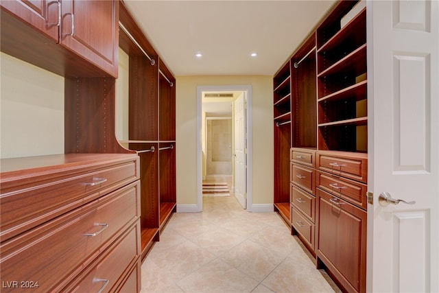 spacious closet with light tile patterned flooring