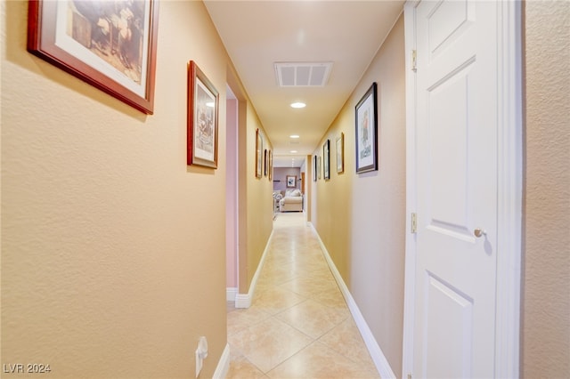 hallway with light tile patterned floors