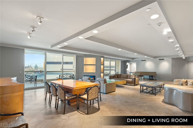 dining area featuring floor to ceiling windows