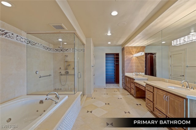 bathroom with independent shower and bath, vanity, and tile patterned floors