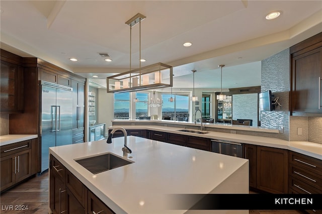 kitchen featuring sink, dark hardwood / wood-style flooring, stainless steel appliances, and tasteful backsplash