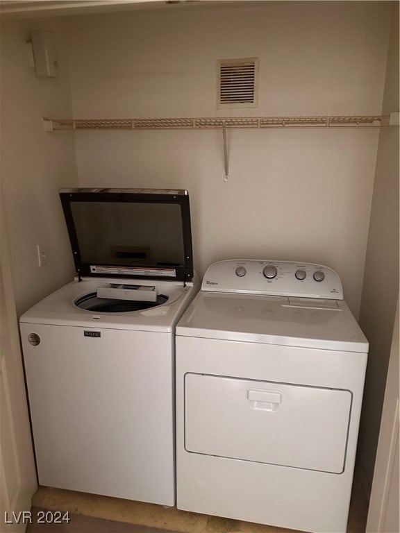 laundry area featuring washing machine and dryer