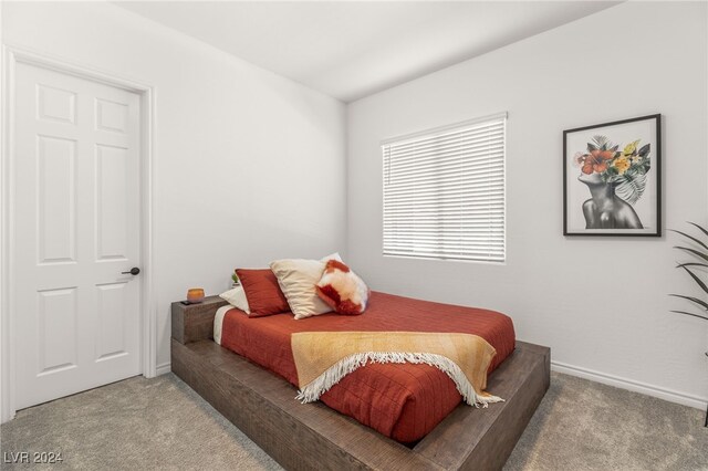 bedroom with light colored carpet