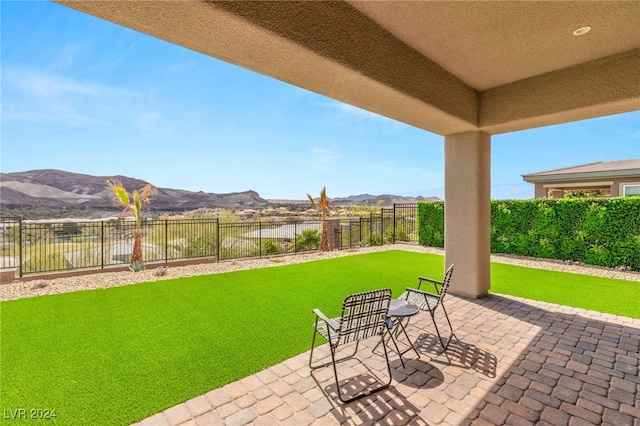 view of patio / terrace with a mountain view