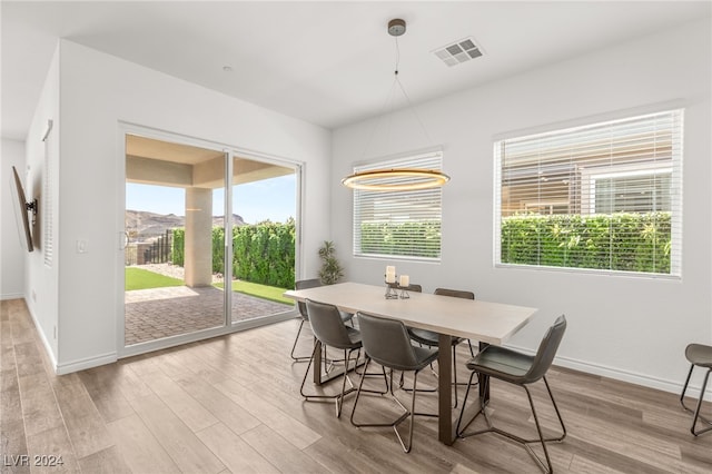 dining area featuring light wood-type flooring