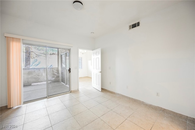 unfurnished room featuring light tile patterned flooring