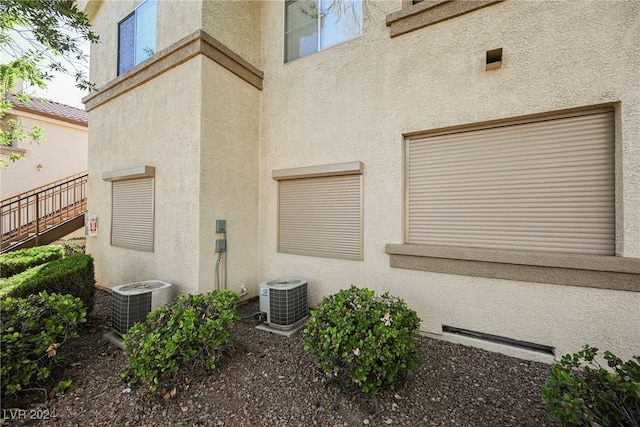 doorway to property featuring a garage and central AC