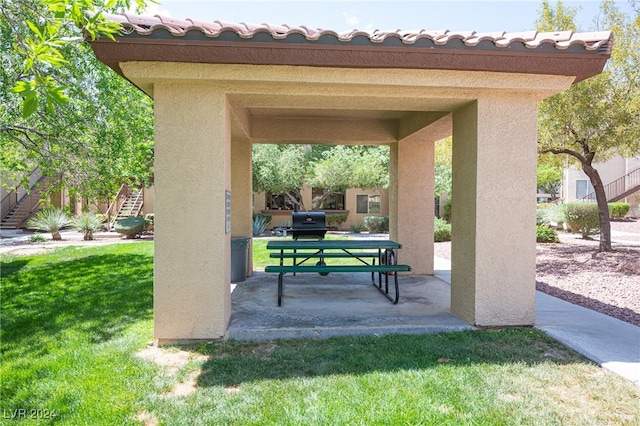 exterior space featuring a lawn and a patio