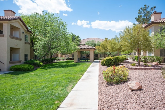 surrounding community featuring a gazebo and a lawn