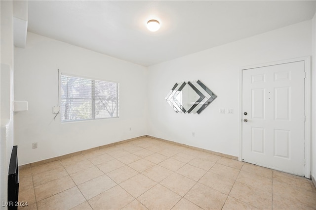 empty room featuring light tile patterned floors