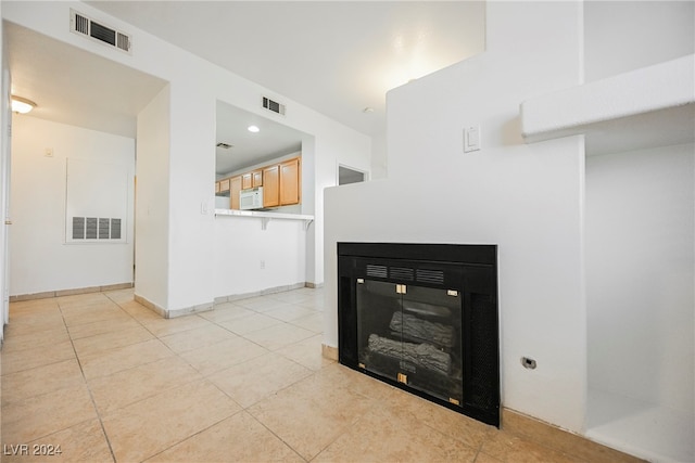 living room with light tile patterned floors