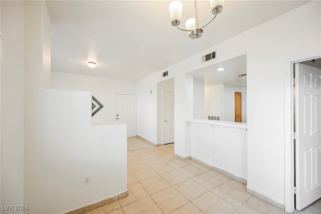 kitchen with hanging light fixtures and light tile patterned flooring